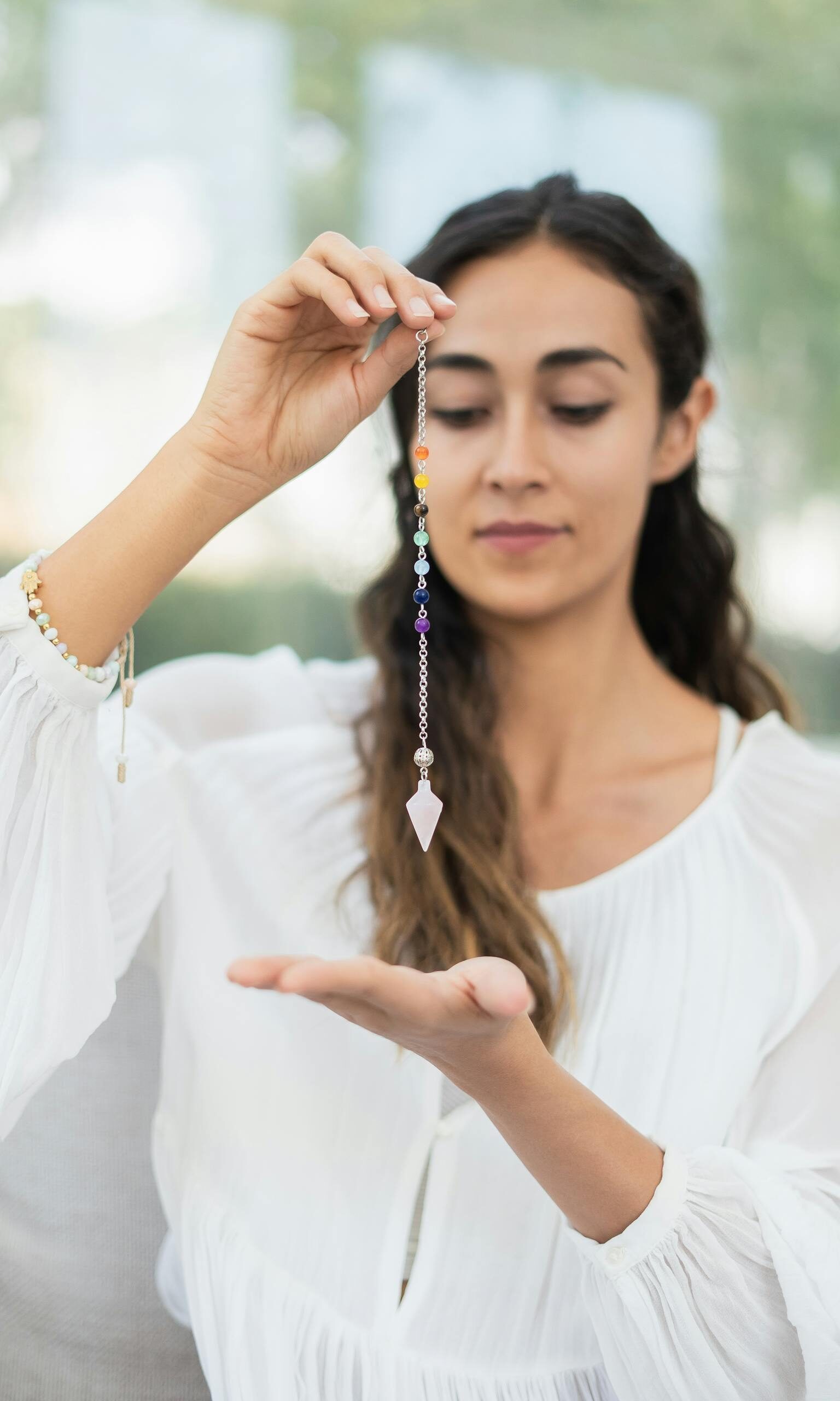 Woman Healing her Chakras with Healing Stones